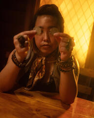 Pōhutukaryl Cosplay as Eurydice from Hadestown, holding coins to her eyes