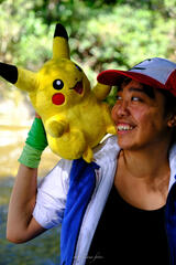 Pōhutukaryl Cosplay as Ash Ketchum, laughing with Pikachu
