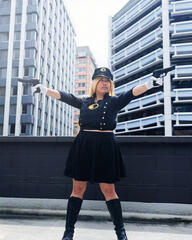 Pōhutukaryl Cosplay as Lady Blackhawk, pointing two guns