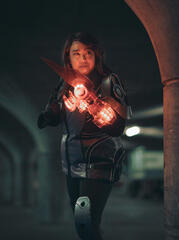 Pōhutukaryl Cosplay as Ashley Williams from Mass Effect 3, holding a glowing omniblade