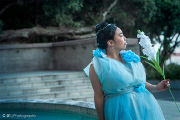 Pōhutukaryl Cosplay as Rachel Chu from Crazy Rich Asians in a blue dress