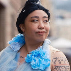 Pōhutukaryl Cosplay cosplaying Rachel Chu from Crazy Rich Asians, smirking to the right